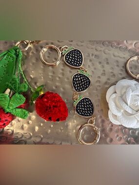 Three bag charm set. Leather flower, bag extender and charm with strawberries.